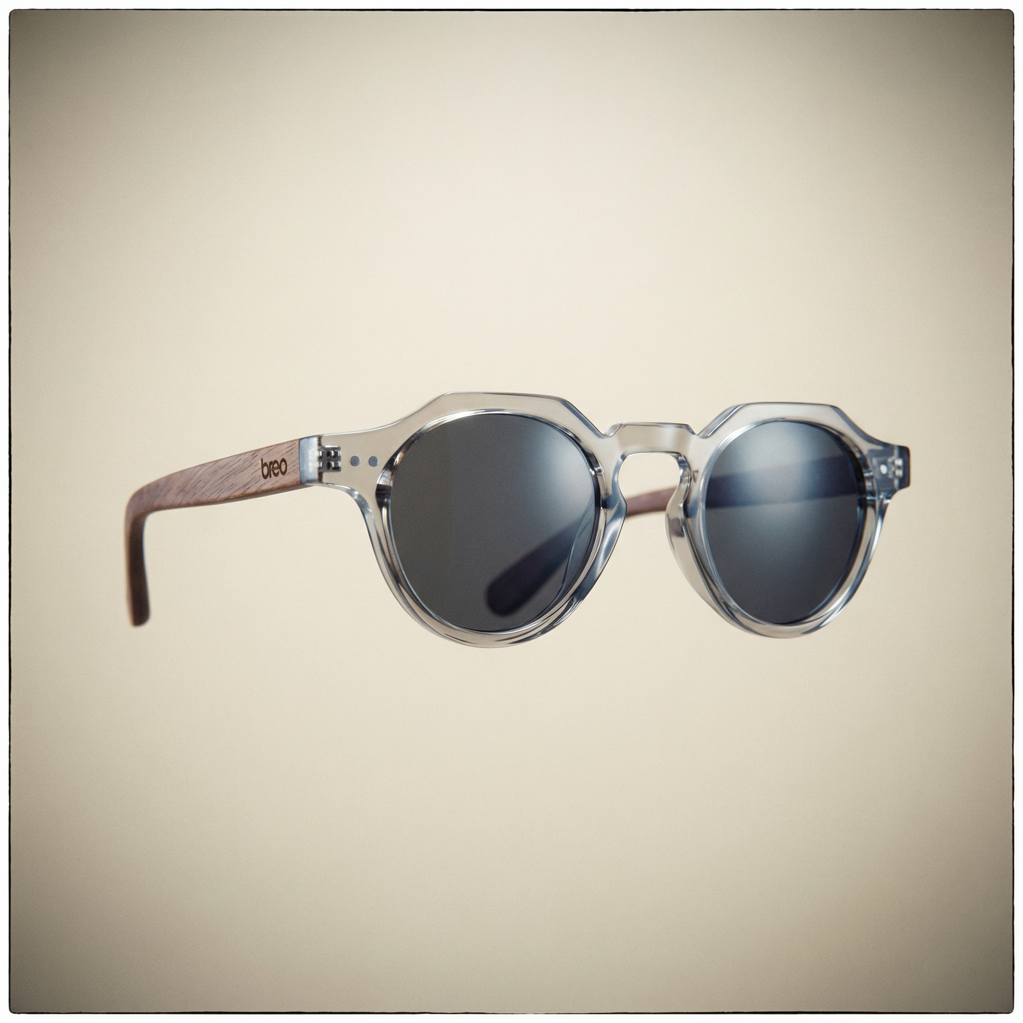 Round sunglasses with wooden arms on a beige background