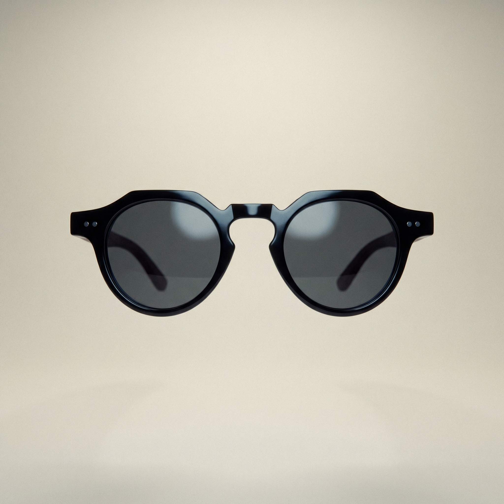 Black sunglasses with dark lenses on a beige background